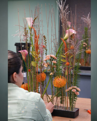 Floristry Student making a Parallel Flower Arrangement
